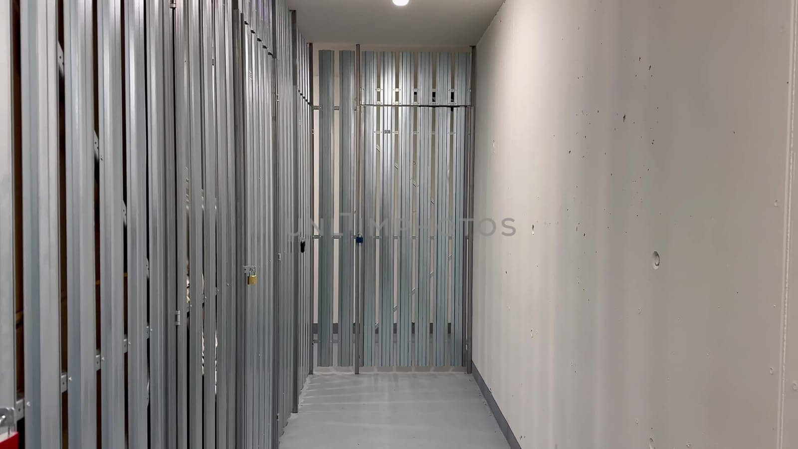 A clean and spacious hallway showcasing metal framing, which is indicative of ongoing construction work activities