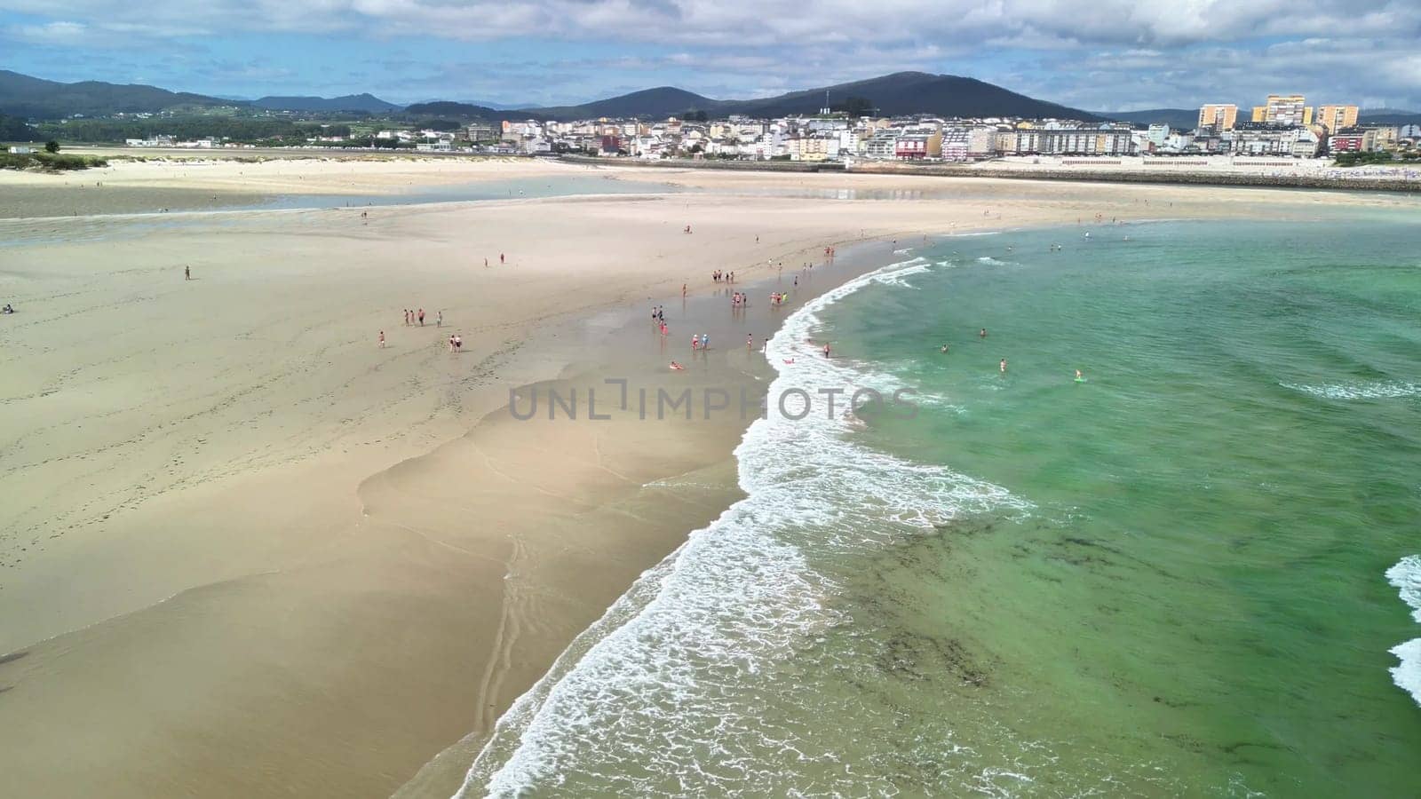 This stunning beach scene with clear turquoise water and golden sand is perfect for ultimate summer relaxation