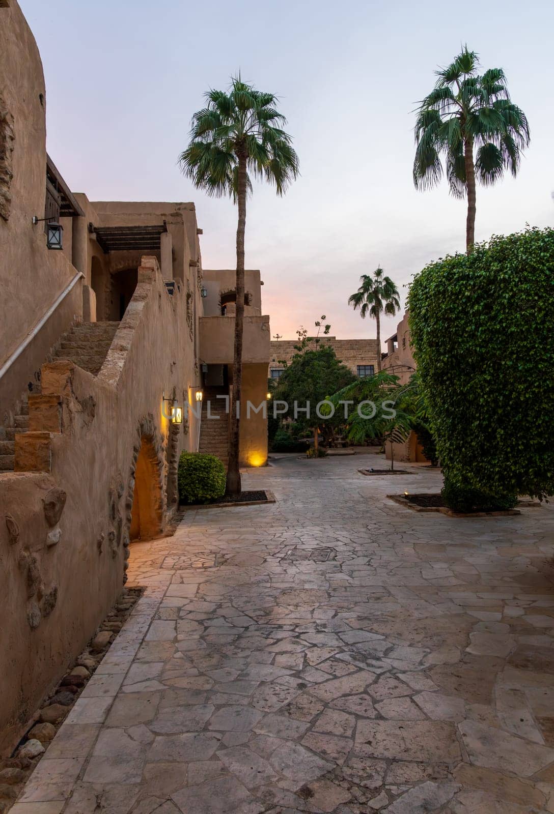 Amman, Jordan - 8 November 2024: Dusk in the courtyards of Movenpick Hotel and Spa by the Dead Sea in Jordan