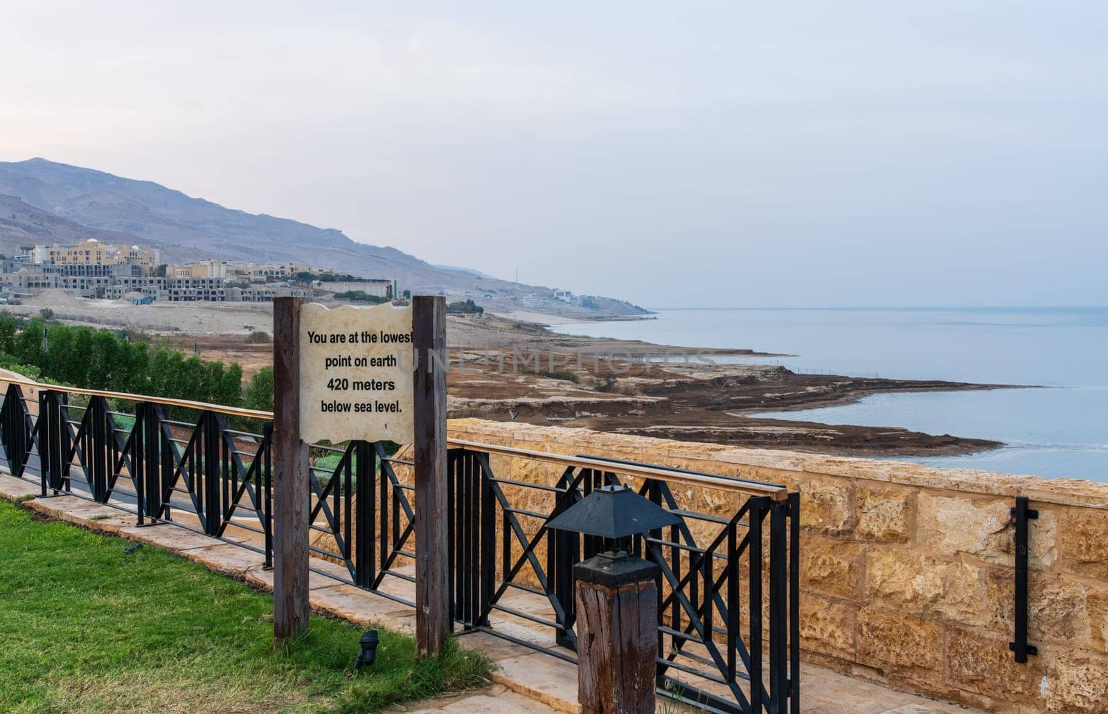 Sign by the Dead Sea in Jordan stating the lowest point on earth at 420m below sea level