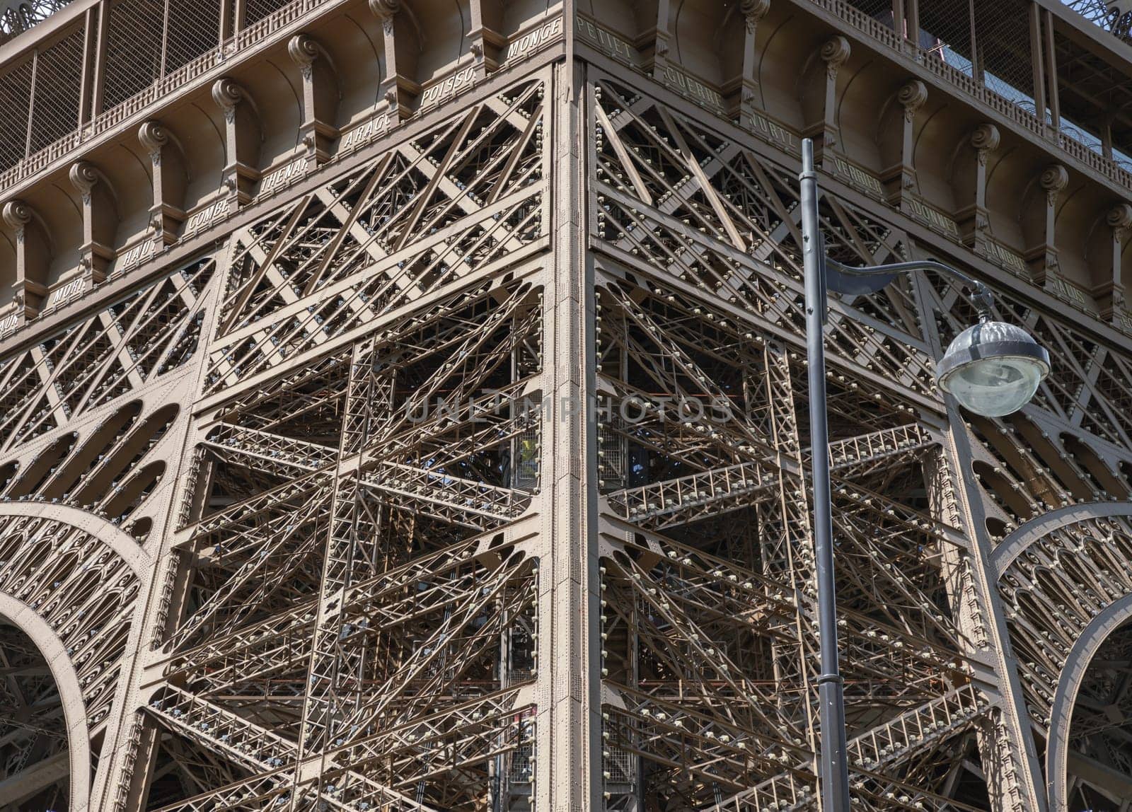 France, Paris - May 03, 2025 - Iconic Landmark Steel Structure of The Ultimate Eiffel Tower architecture details in Paris. Close-up of the framework of the Eiffel Tower, use it as your Wallpaper, Poster and Space for text, Selective focus.