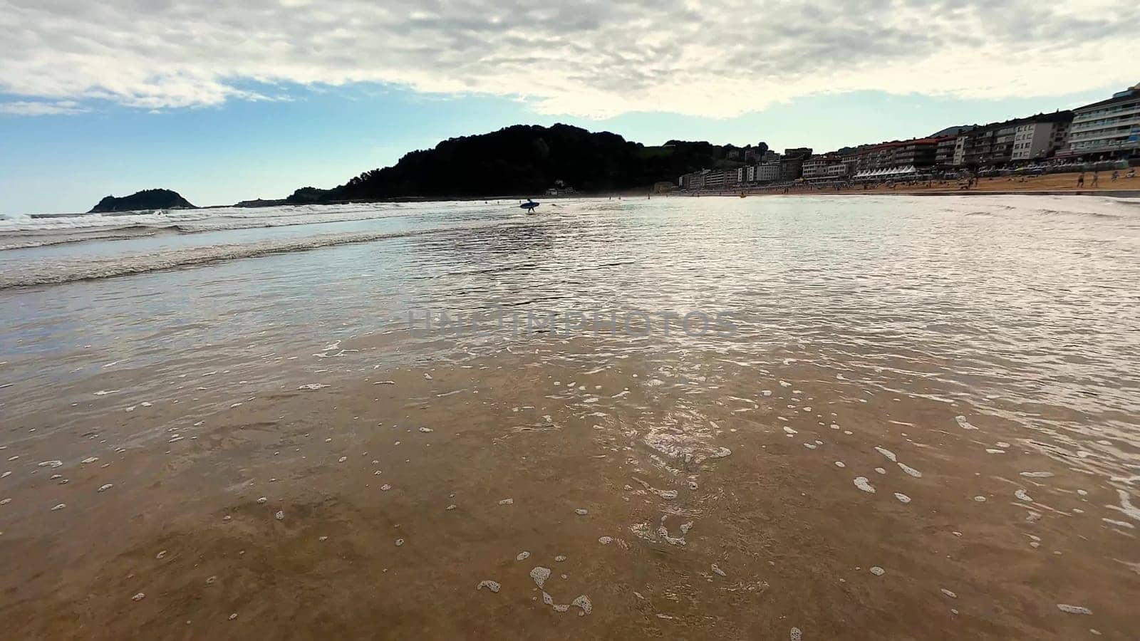 Imagine a tranquil beach view with gentle waves reflecting the beautiful sky and scenic coastal hills nearby