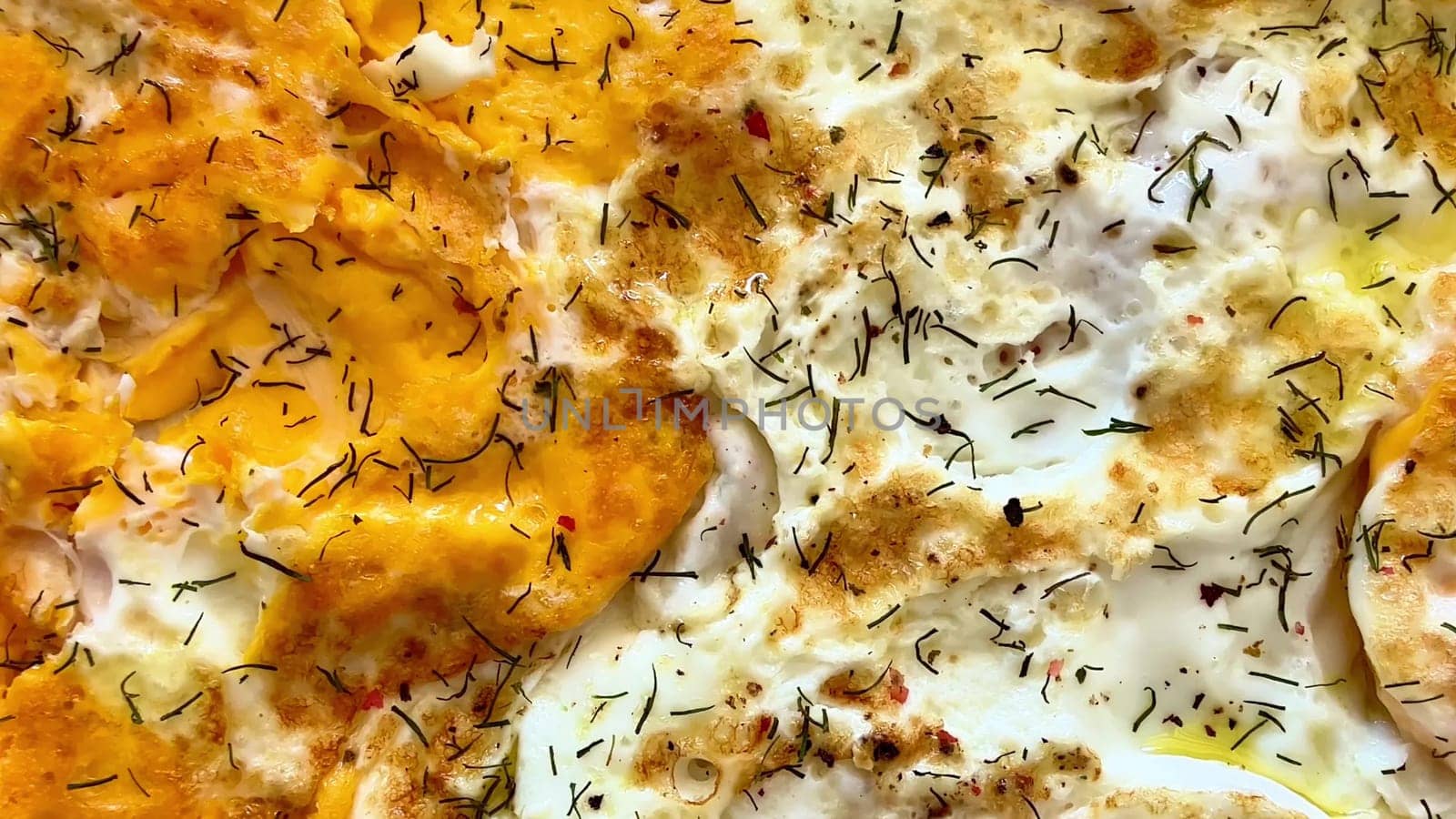 Tasty eggs garnished with fresh herbs, served on a white plate for a delightful breakfast experience