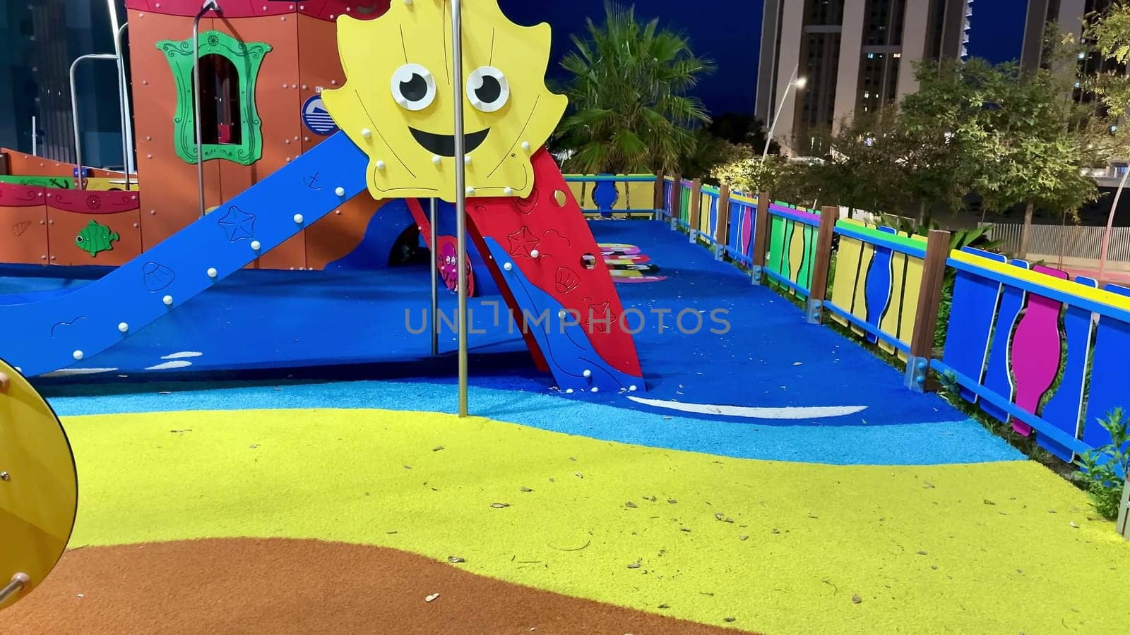 Explore a vibrant playground filled with colorful play structures and safe soft flooring for children.