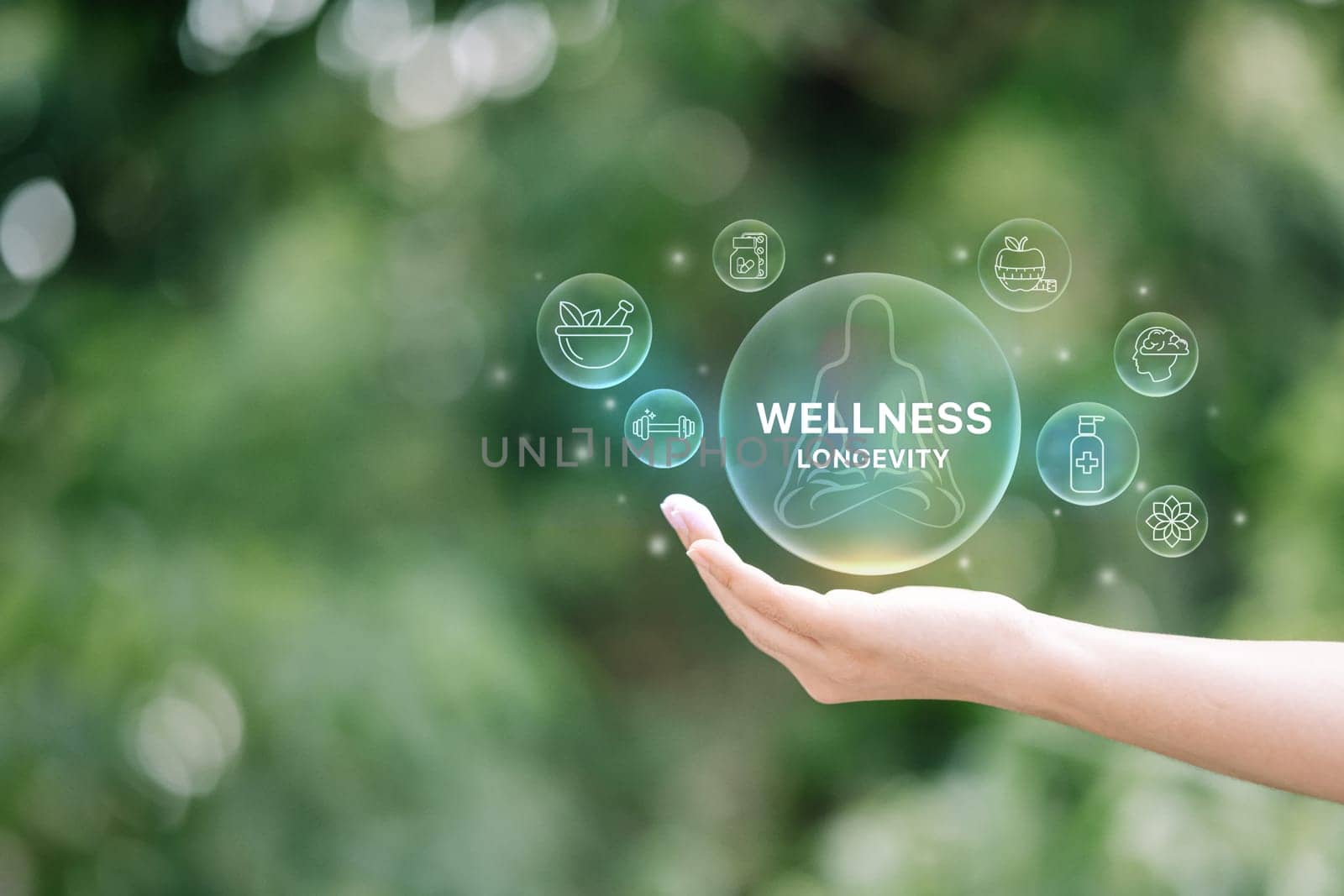 Health and wellness concept with glowing icons including fitness, and mental care, floating above a hand..