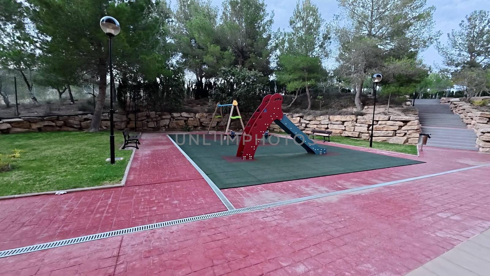 Explore this vibrant playground, with exciting slides, swings, and activities for outdoor childrens fun
