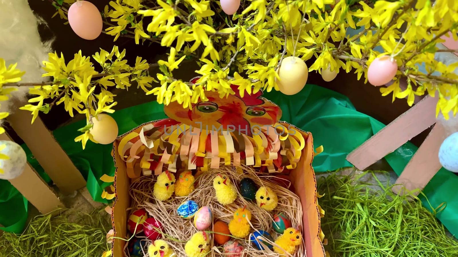 A charming Easter scene with vibrant eggs, cheerful chicks, and colorful spring decorations all around