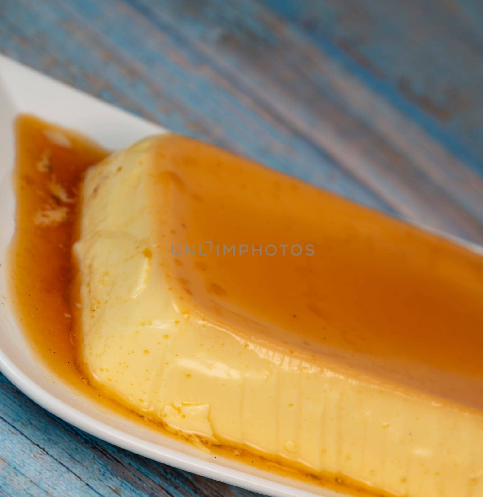Cream caramel pudding with caramel sauce on a plate, Flan, High quality photo