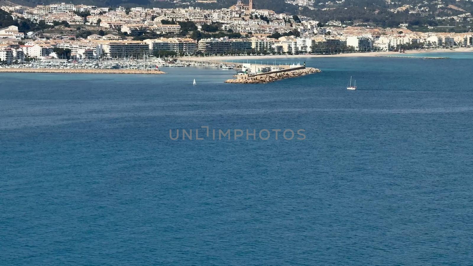 Stunning seaside landscape of Nice, showcasing clear waters, a picturesque promenade, and charming buildings.