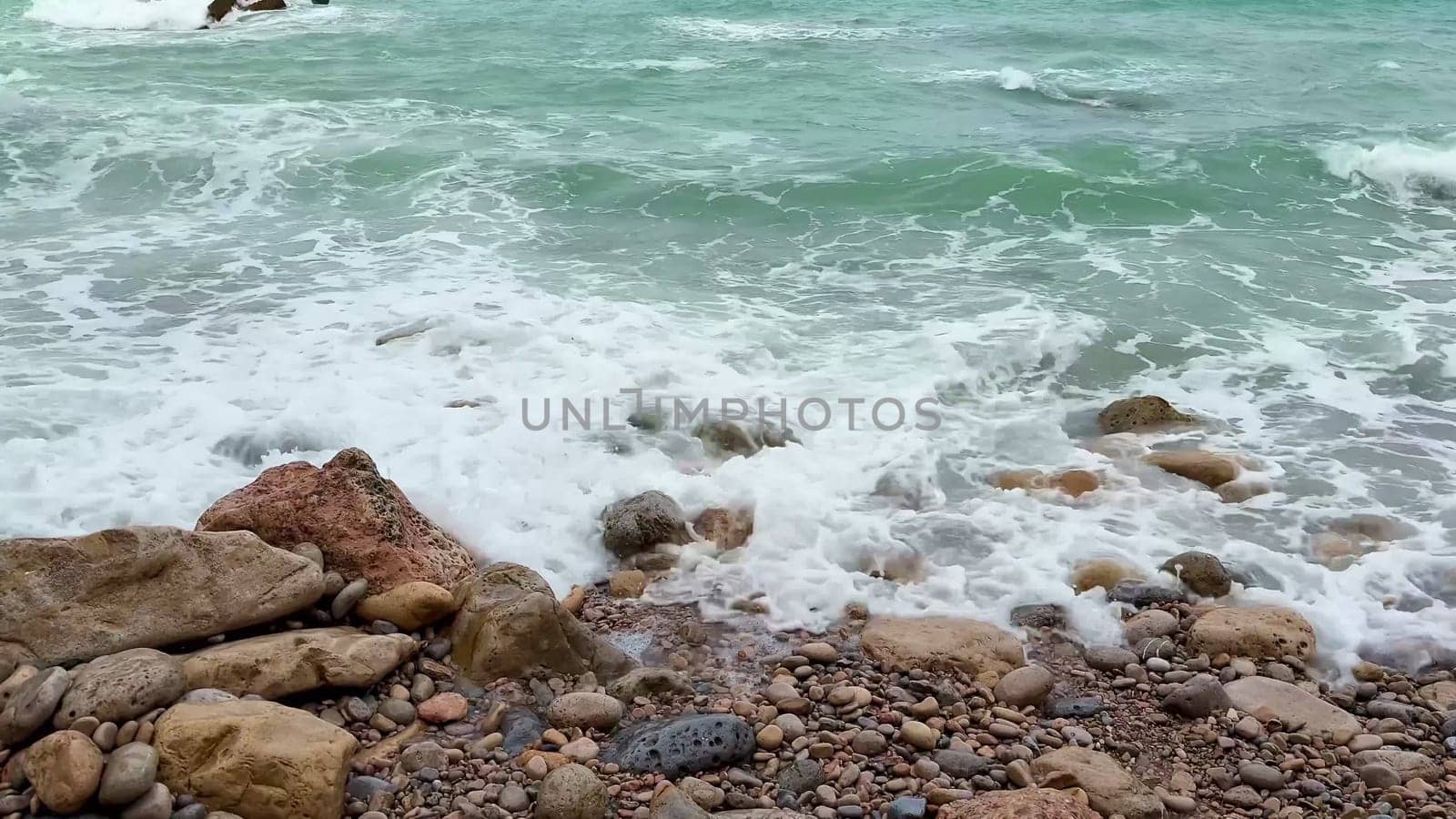 Dynamic ocean waves gracefully rolling over rugged rocks along a beautiful and scenic coastline landscape