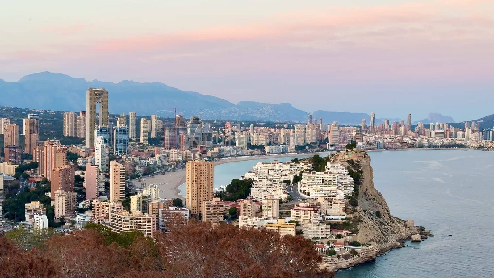The stunning skyline and serene coastline offer a beautiful mix of natural beauty and urban architecture