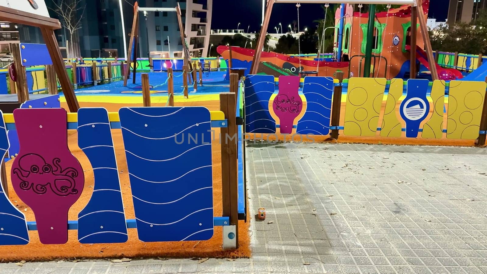 A vibrant playground filled with unique art designs, it is perfect for providing entertainment to children at night