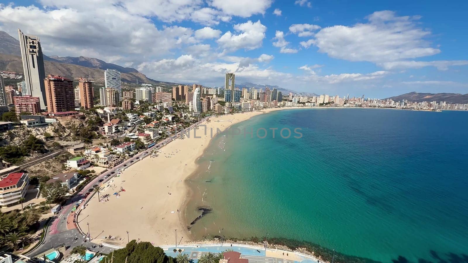 Experience the breathtaking aerial view of Benidorm, which beautifully showcases its stunning beach and skyline