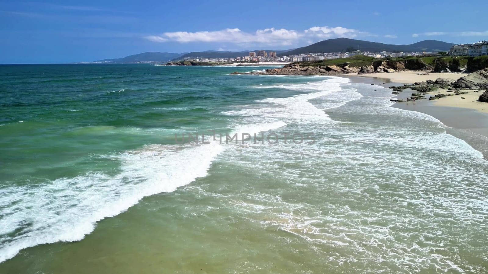 A breathtaking beach scene showcasing the soothing sound of gentle waves rolling in against a beautiful horizon