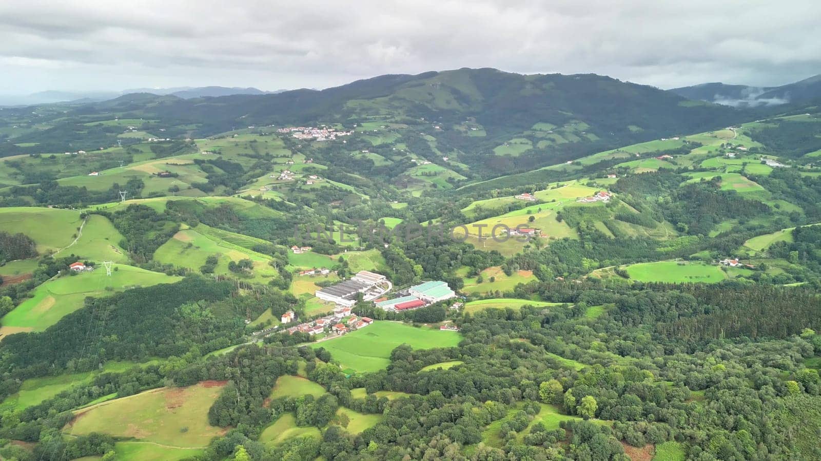 Stunning aerial footage beautifully showcasing stunning verdant hills and a serene, picturesque rural landscape