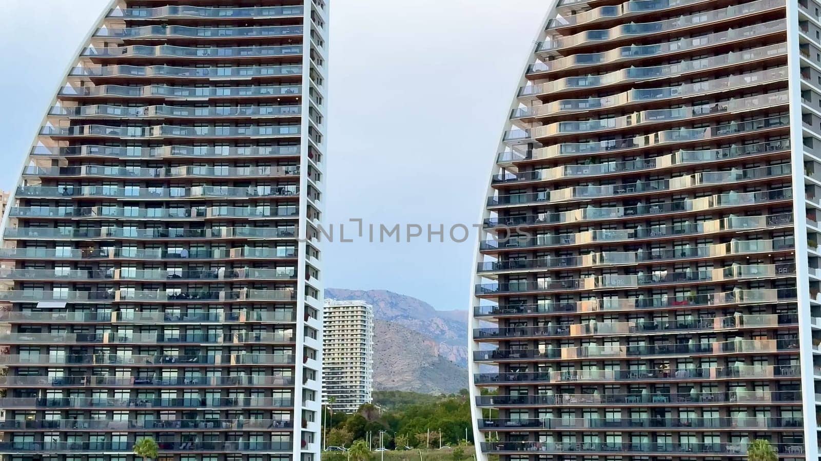 These twin towers showcase modern design and innovative architecture against a serene, beautiful backdrop