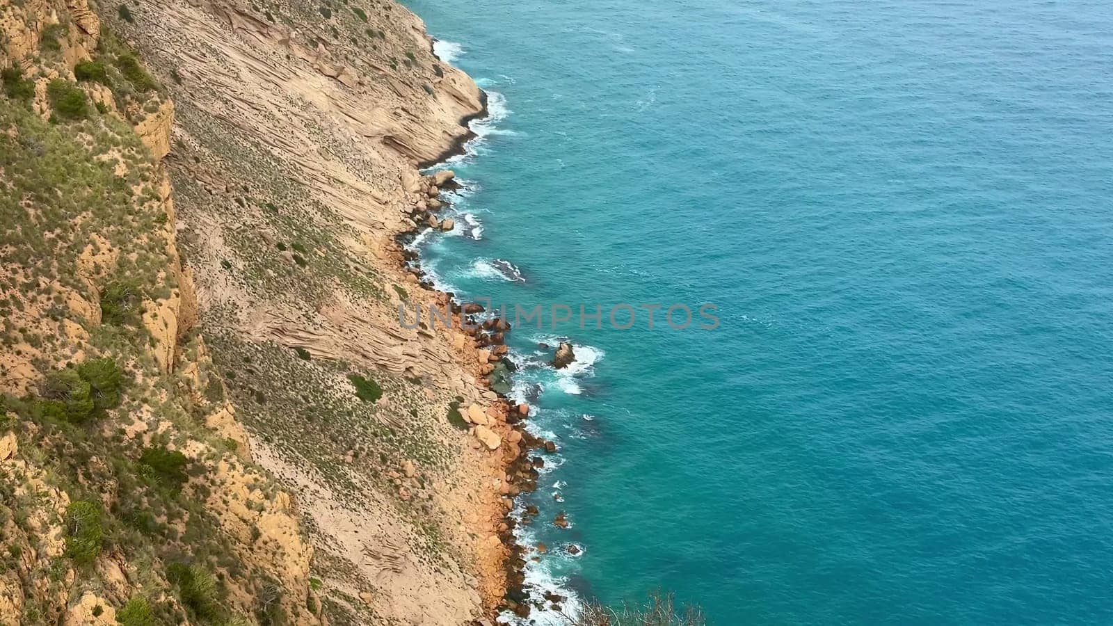 Experience stunning views of rocky coastlines meeting calm blue waters, perfect for nature lovers seeking beauty