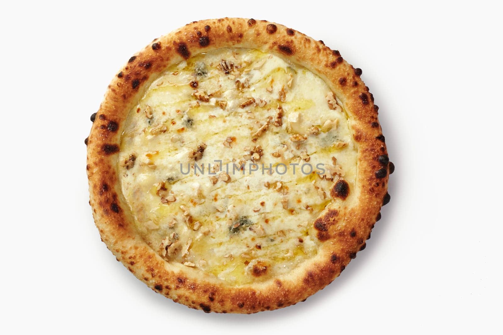 Top view of four cheese pizza with walnuts, showing the delicious combination of melted cheese and crunchy nuts