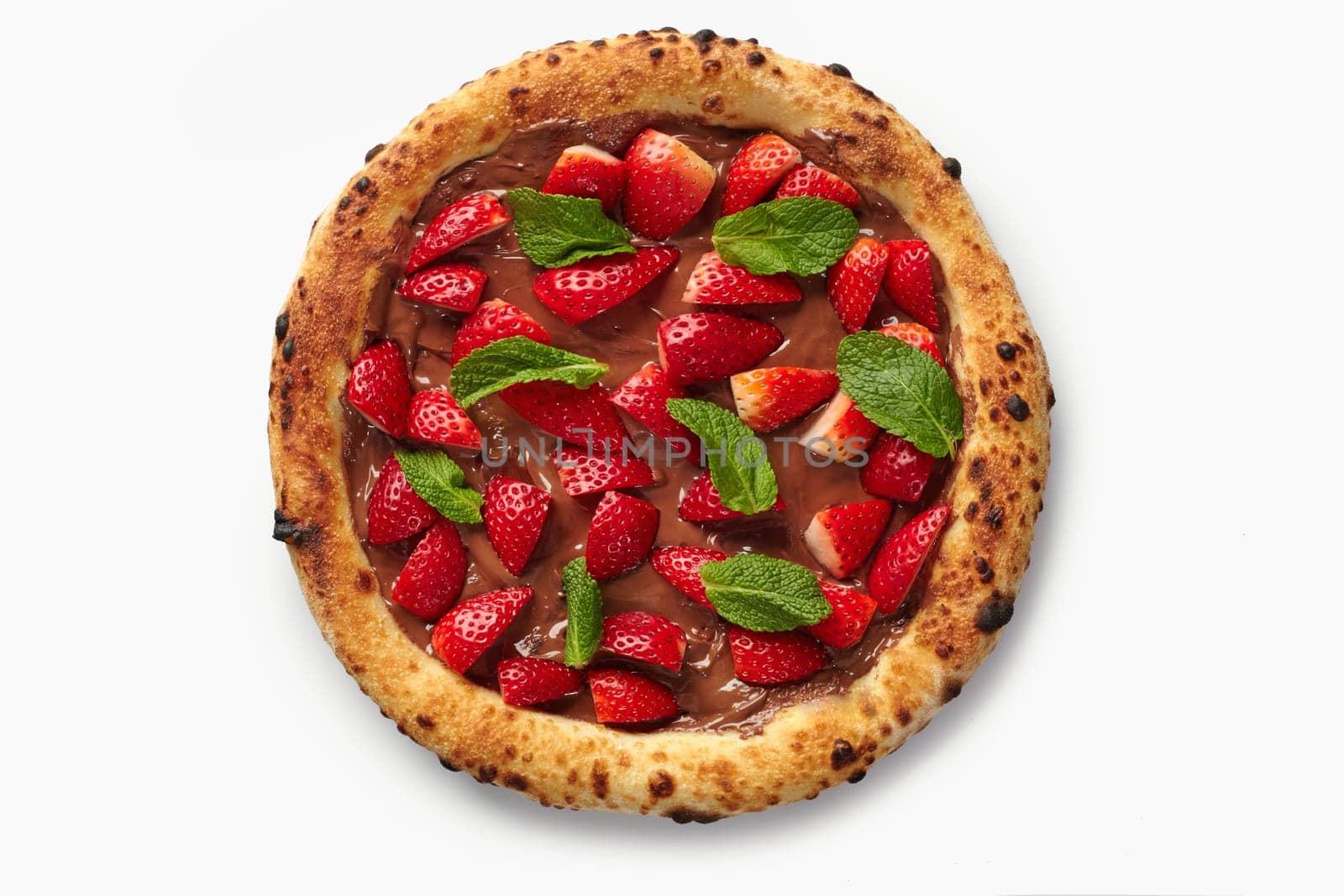 Sweet pizza with chocolate cream, fresh strawberries and mint on a white background