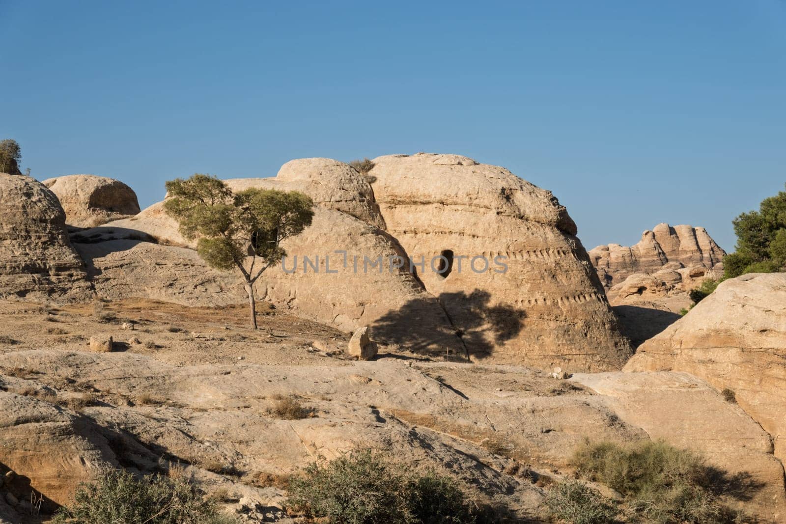 Burial caves in the Necropolis hills on walk from entrance to As Siq in Petra