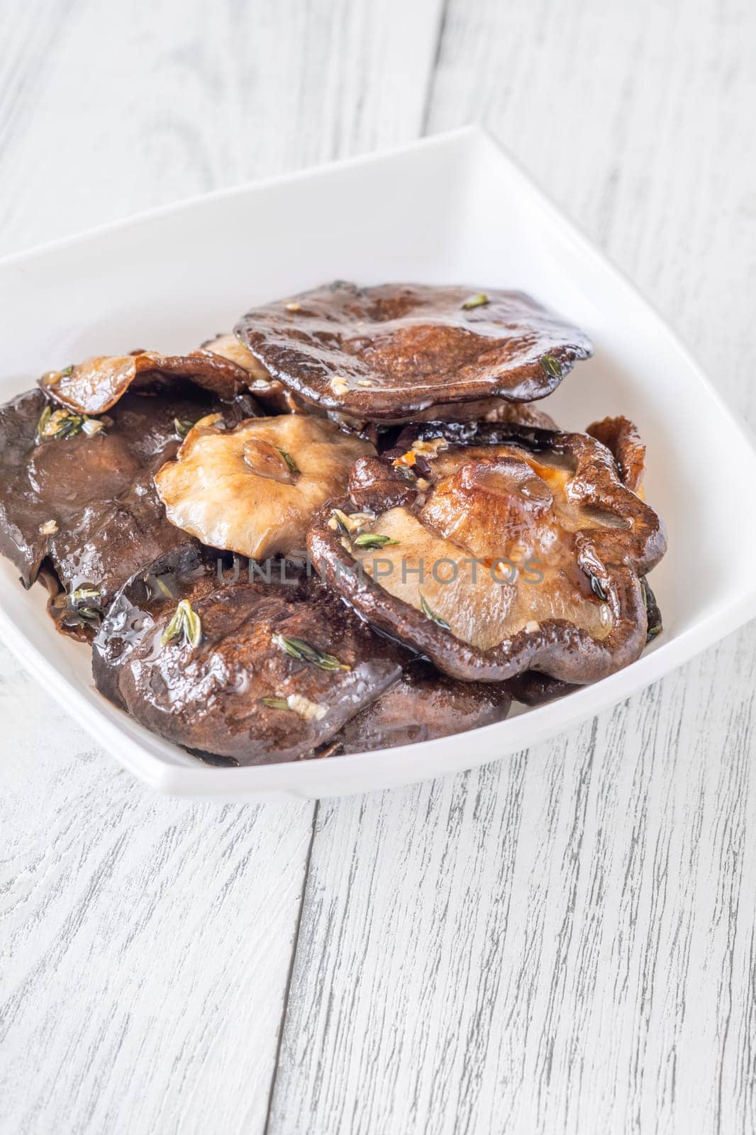 Fragrant shiitake mushrooms fried with thyme and garlic, rich earthy umami aroma