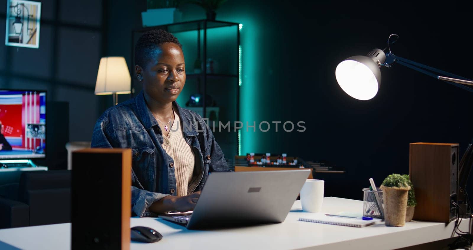 Focused freelancer working from home, typing on laptop, writing in document. Remote employee scrolling on digital device and sending emails to business associates, camera B close up