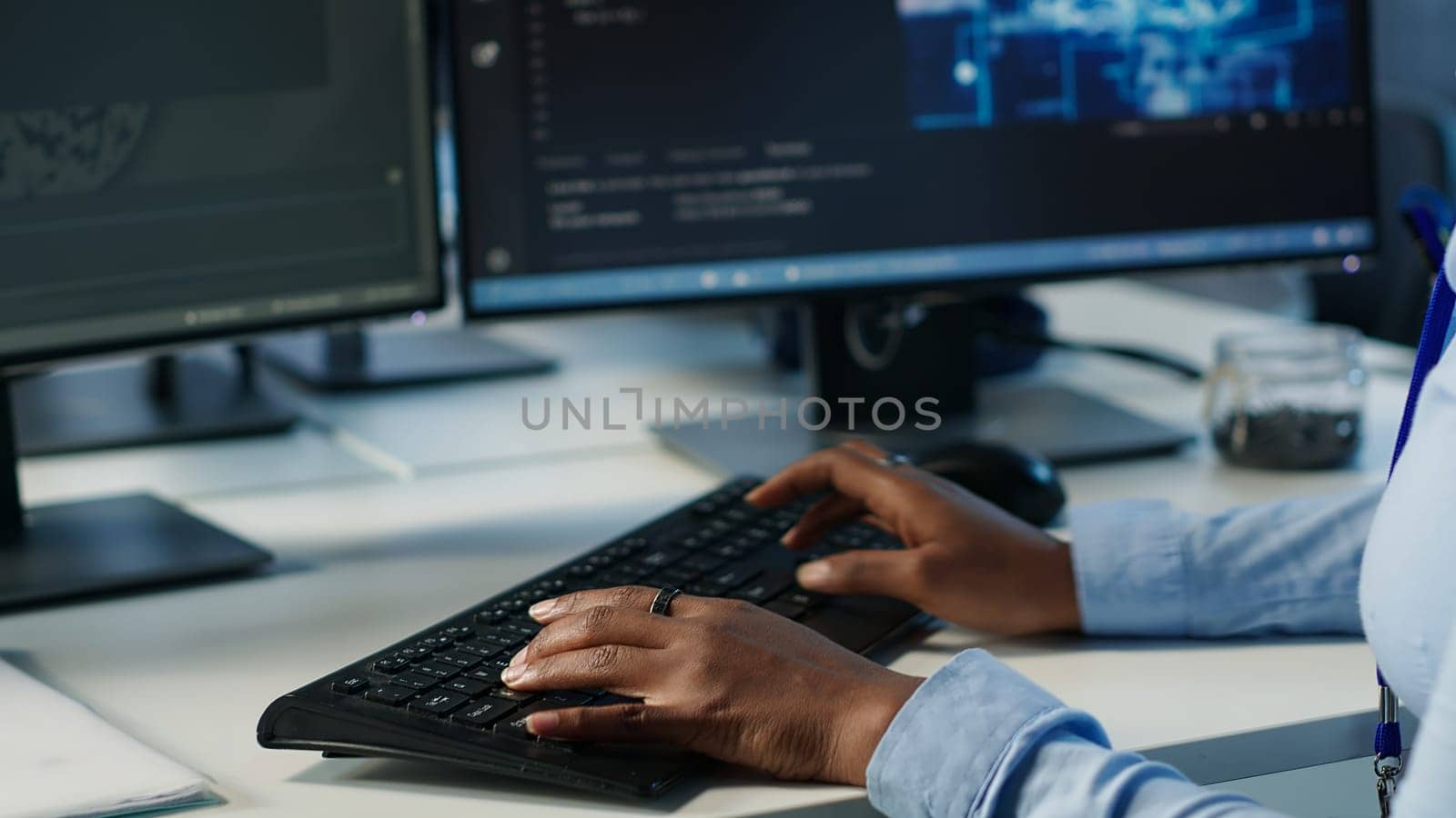Data center admin using PC to find misconfigurations affecting rackmounts performance. Person checking servers bottlenecks leading to sluggish data transfer rates and malfunctions, camera A close up