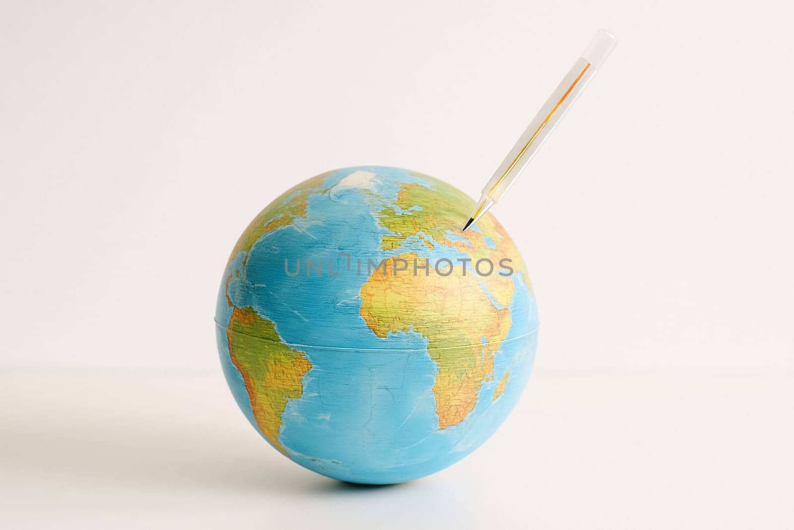 AI generated realistic globe with medical thermometer showing high fever symbolizing global warming and climate crisis concept white background environmental emergency earth protection