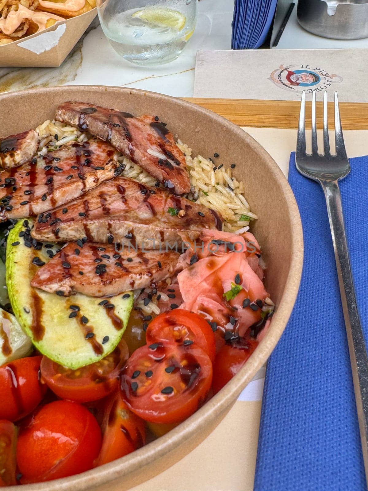 Tivat, Montenegro - April 25, 2025: grilled tuna with vegetables and salad.tuna dish at Il Pescatore cafe. High quality photo