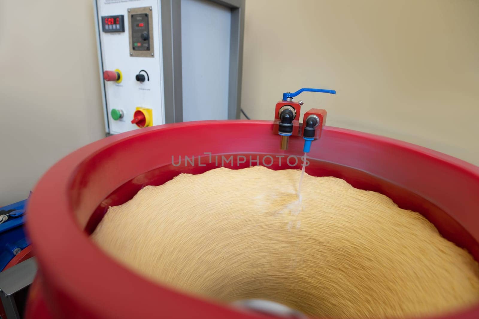 From above view of tumbling machine at work with coins blank