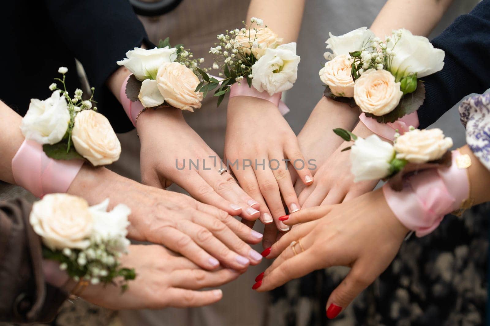 Identical bouquets on ribbon for bridesmaids . bracelets