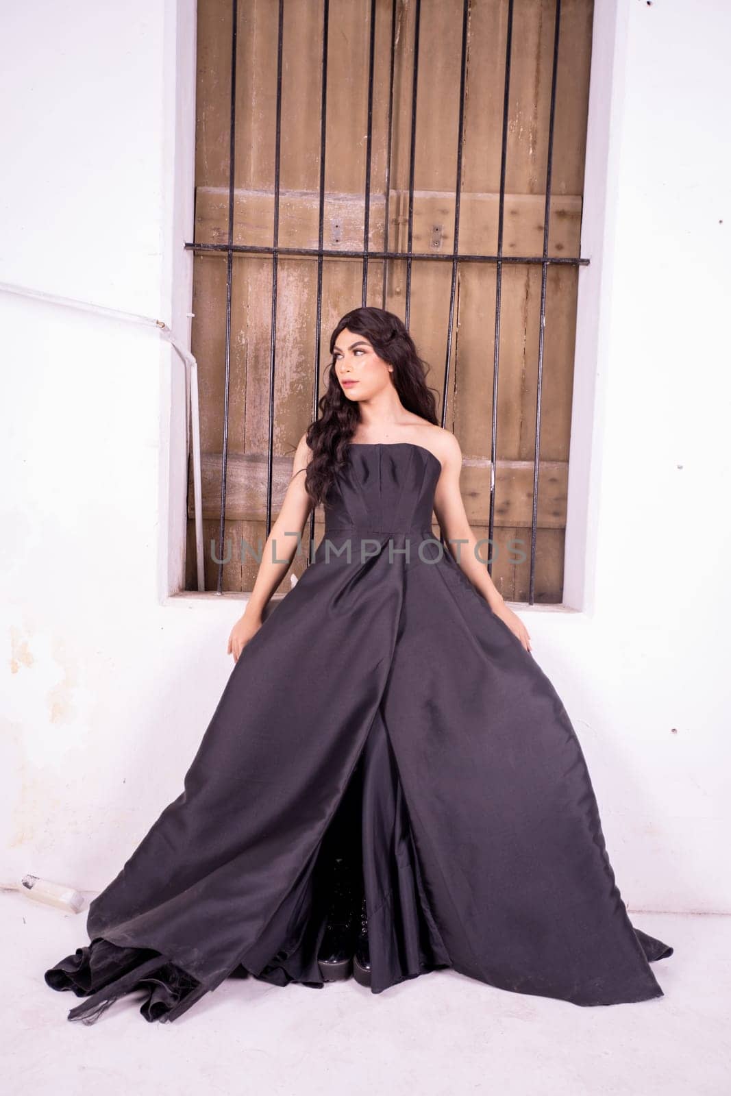 Asian woman standing in the wooden window while wearing a black dress and black hair