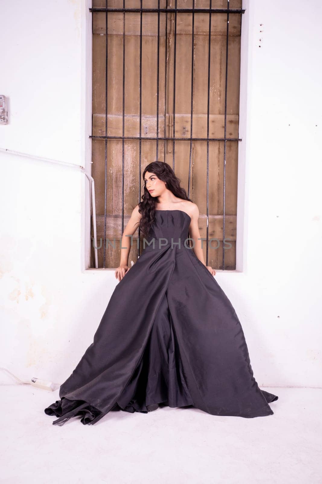Asian woman standing in the wooden window while wearing a black dress and black hair