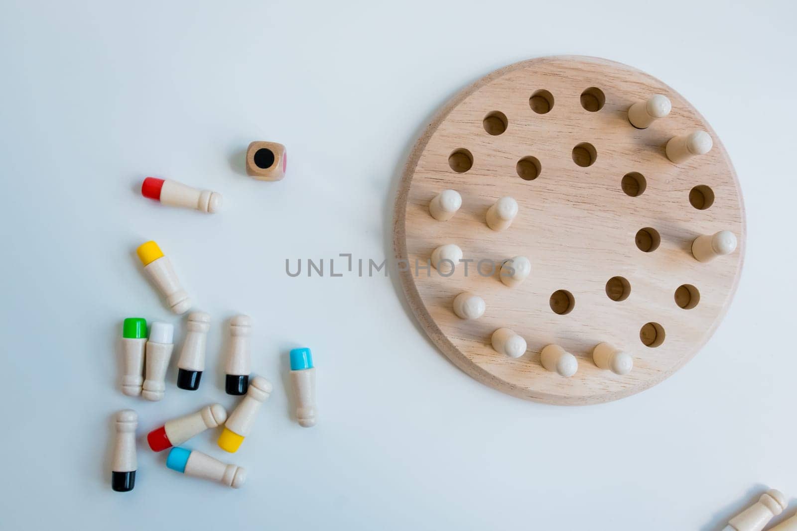 Wooden strategy puzzle with pegs and board for brain training.