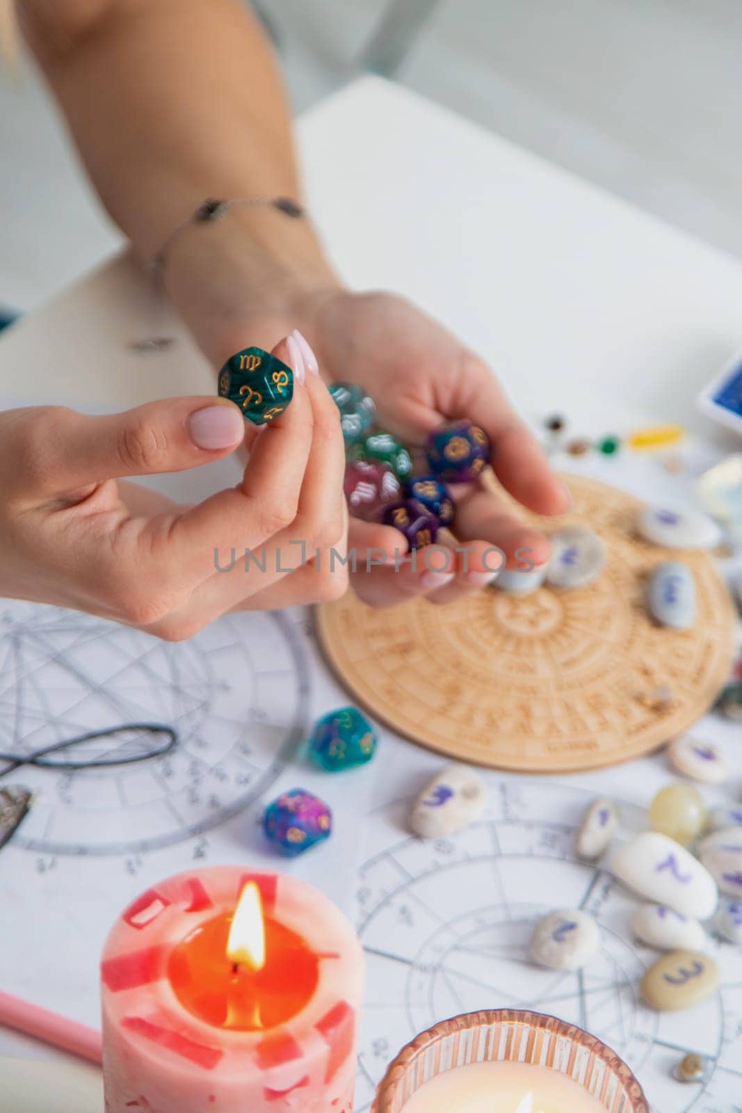 Woman numerologist astrologer counts numbers. Selective focus