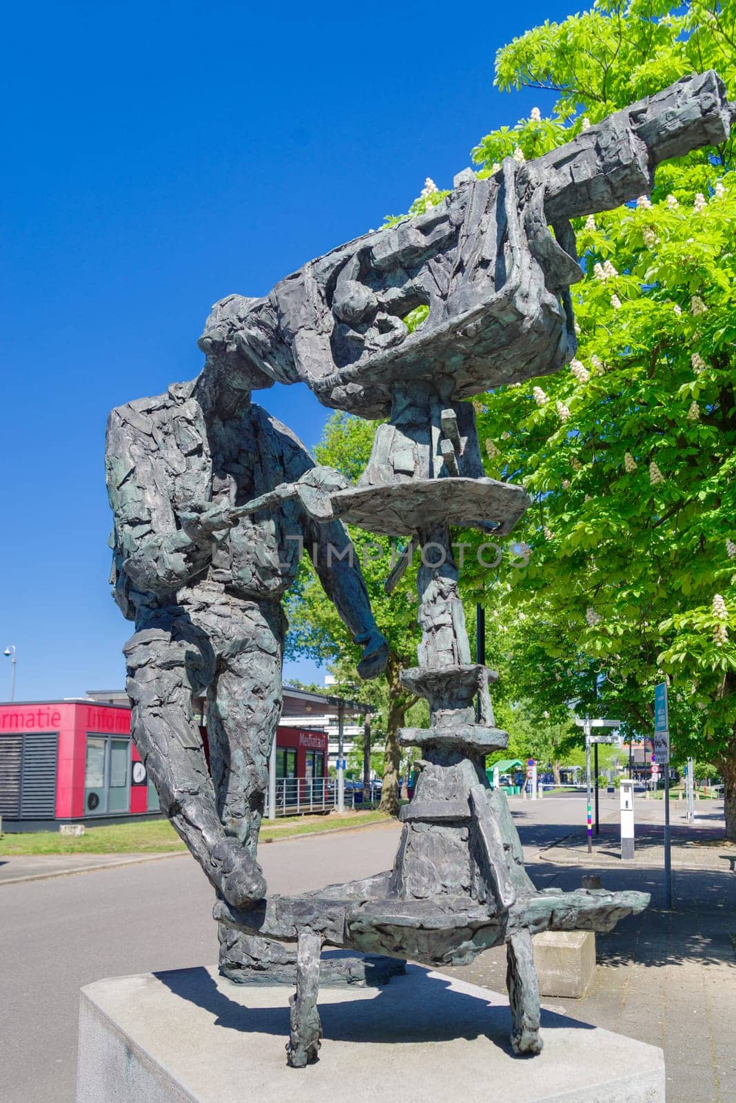 HILVERSUM, NETHERLANDS - MAY 3, 2025: Bronze statue of a camera man at the Hilversum Media Park, produced by Hans Bayens.