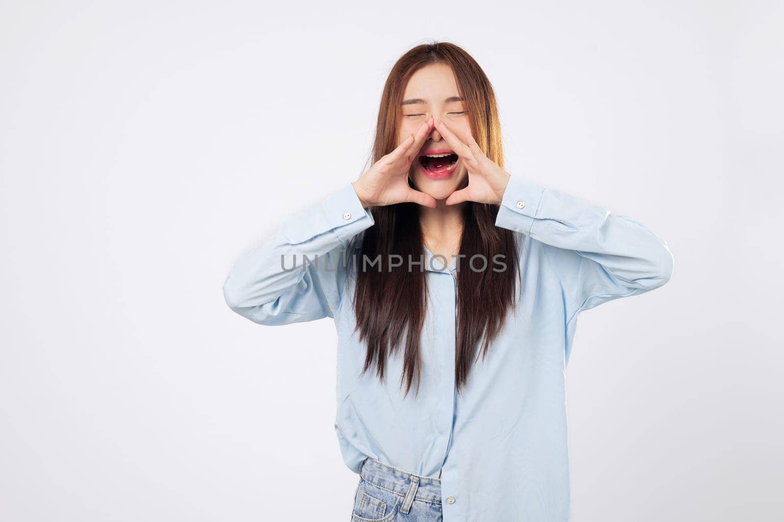 Announcement begins as woman cups hands around her mouth and another woman prepares to shout news, both expressing urgency and emotion isolated on white backdrop.