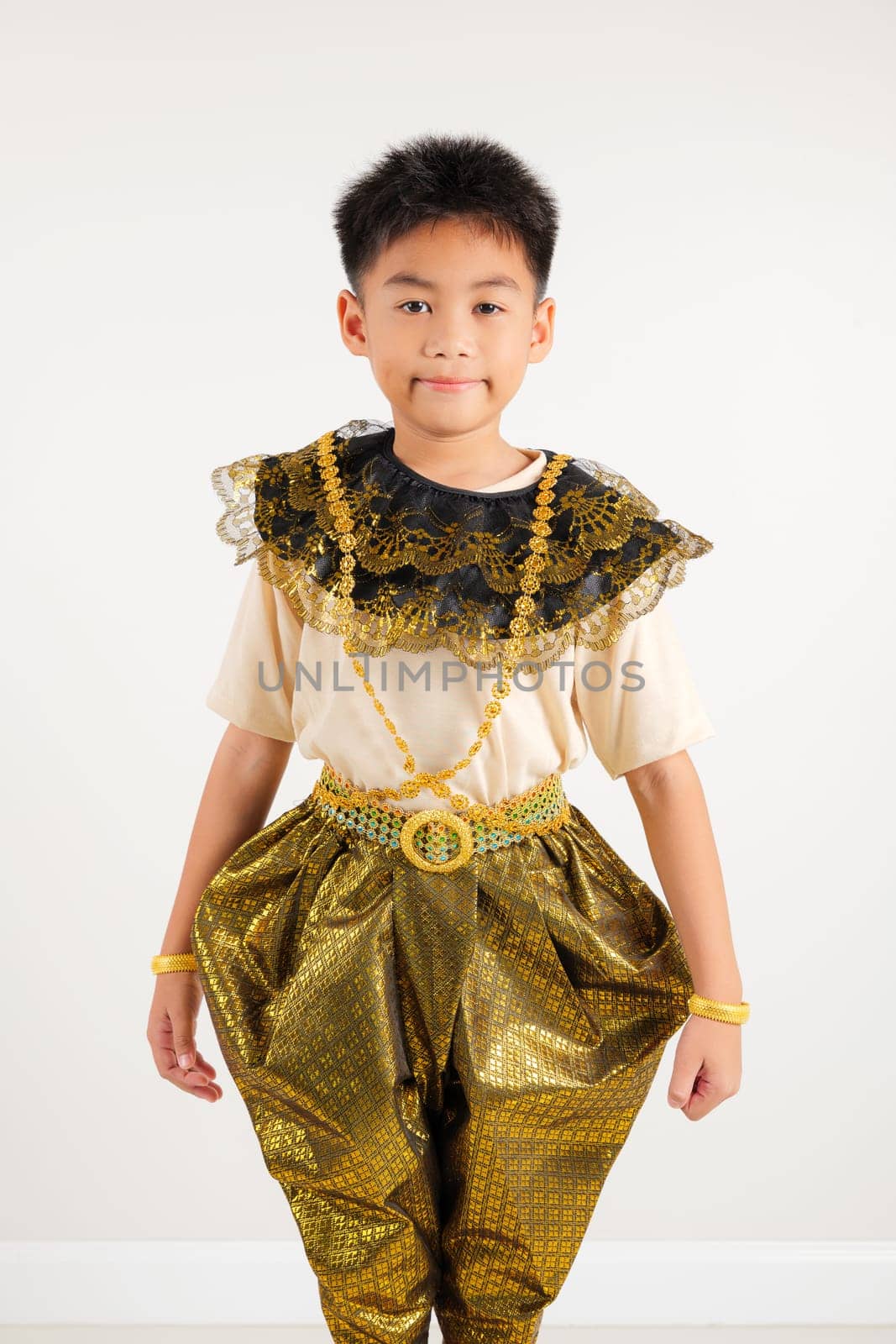 Portrait of Thailand kid boy smiling traditional Thai dress costume in studio shot isolated white background, Happy Portrait primary little