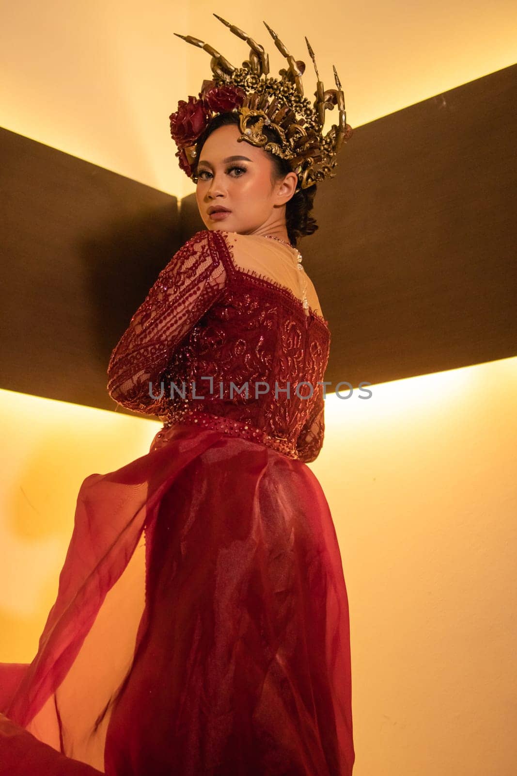 elegance woman wearing a red wedding dress with the crown on the wedding ceremony