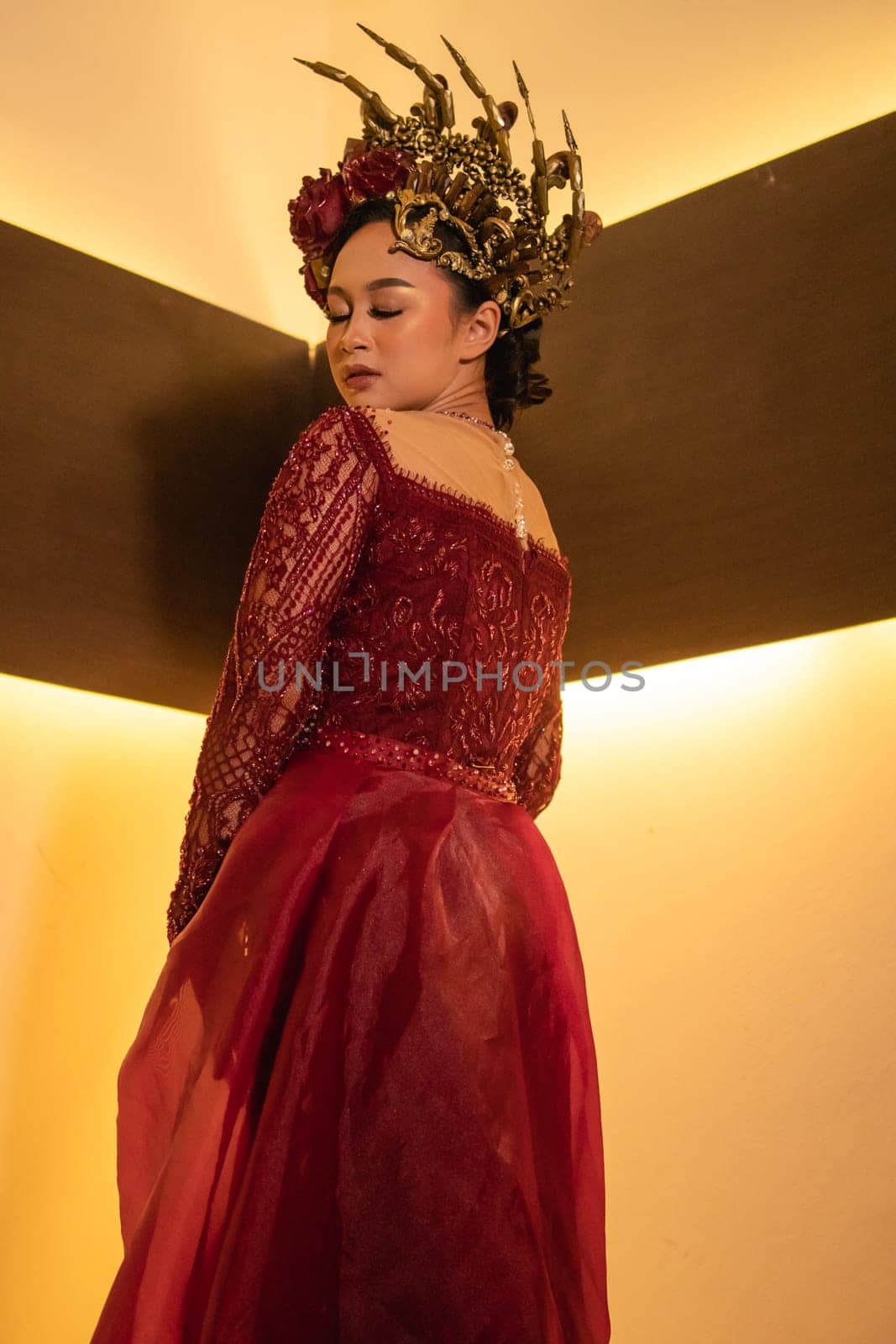 elegance woman wearing a red wedding dress with the crown on the wedding ceremony