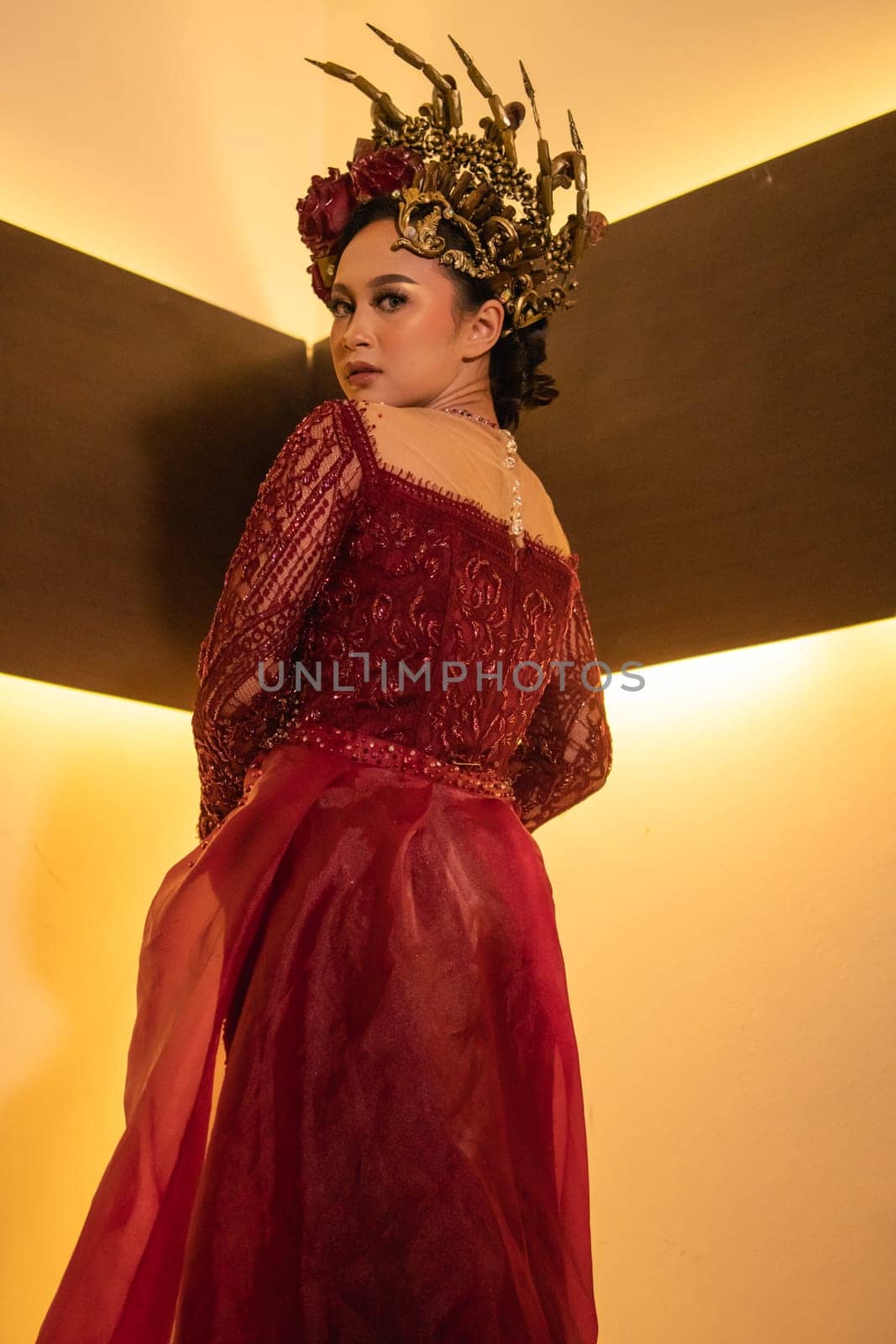 elegance woman wearing a red wedding dress with the crown on the wedding ceremony