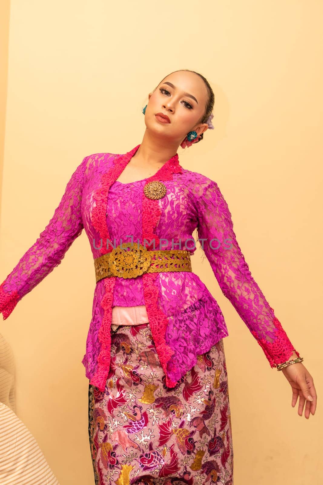 Beautiful bride from Balinese woman with pink dresses and make up on her face before the ceremony began