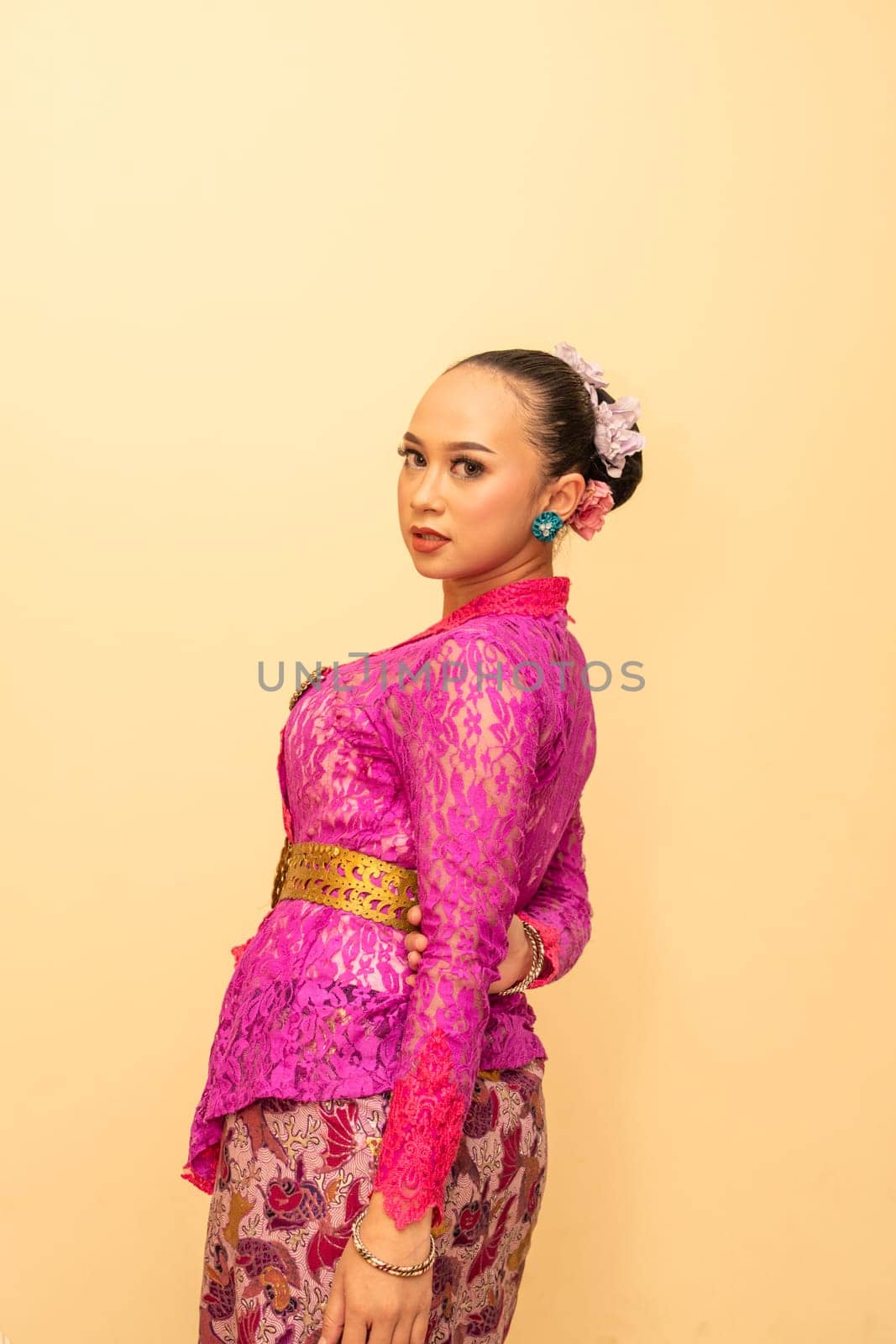 Beautiful bride from Balinese woman with pink dresses and make up on her face before the ceremony began