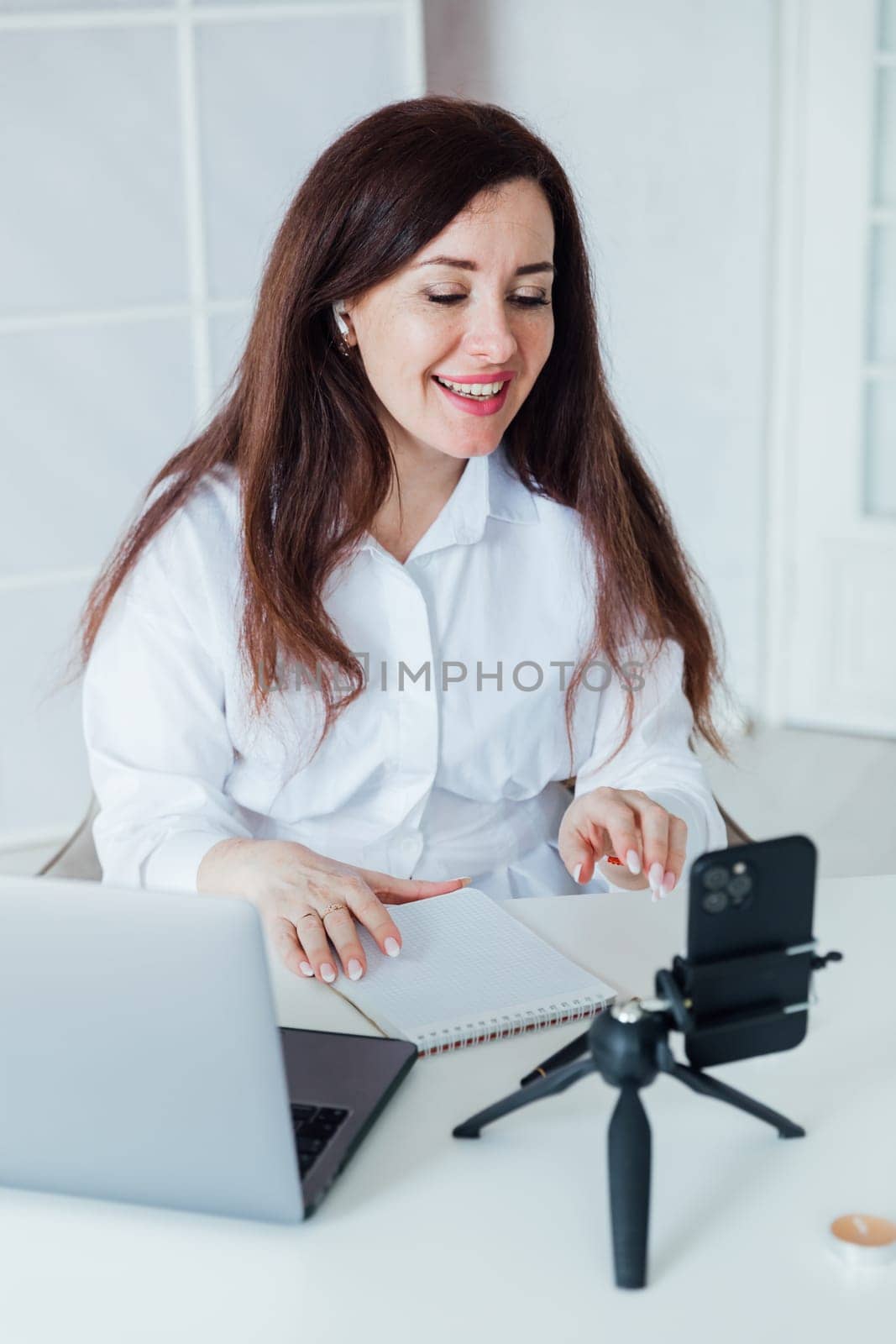 brunette woman working at desk operator remotely online
