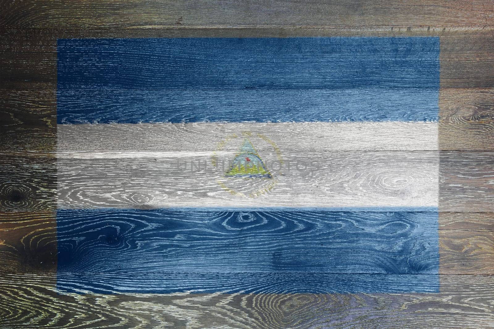 A Nicaragua flag on rustic old wood surface background