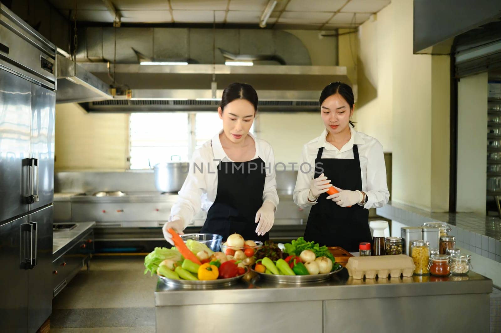 Chef teacher educates culinary students on ingredient selection and recipe techniques.