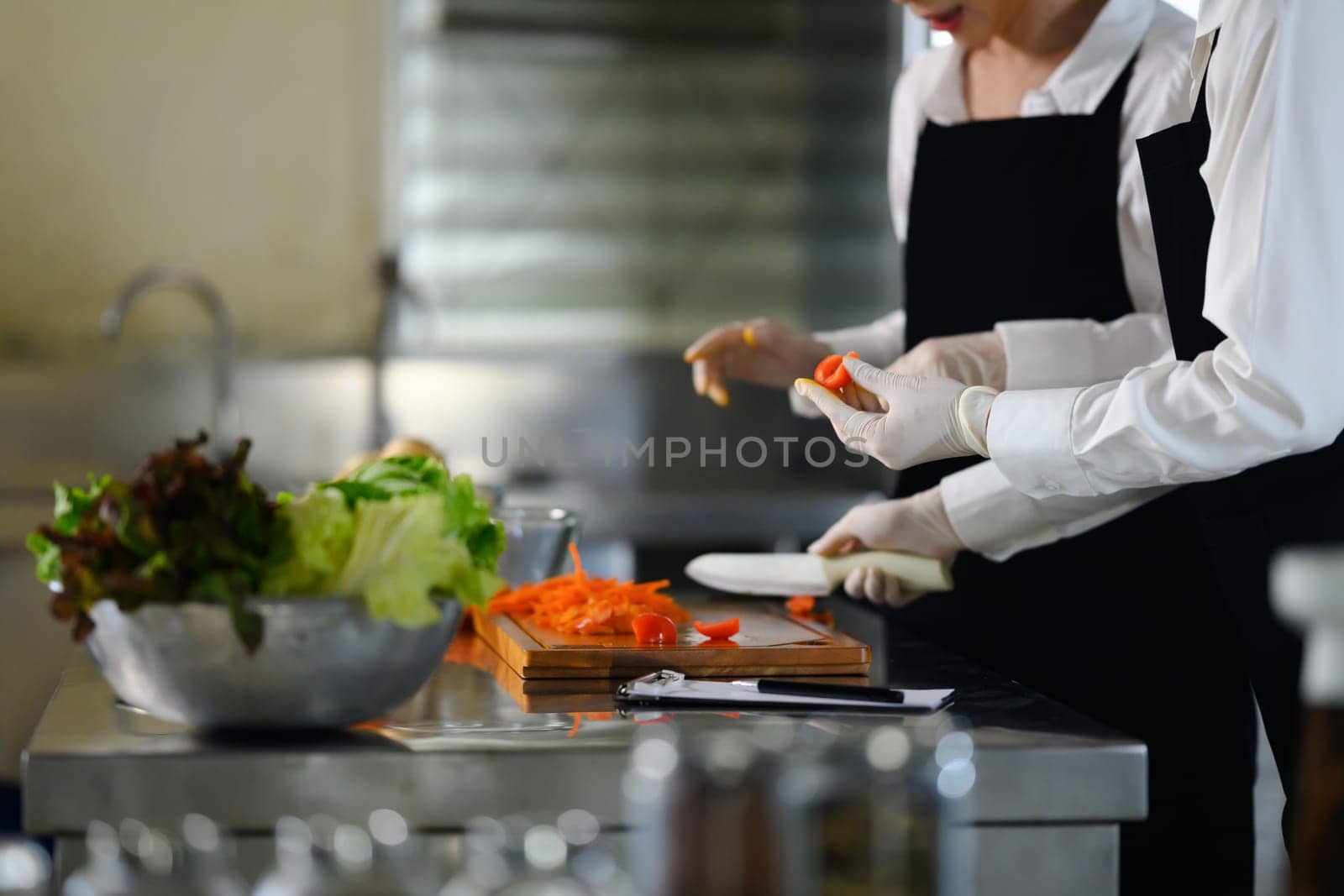 Culinary students washing produce in a cooking school.