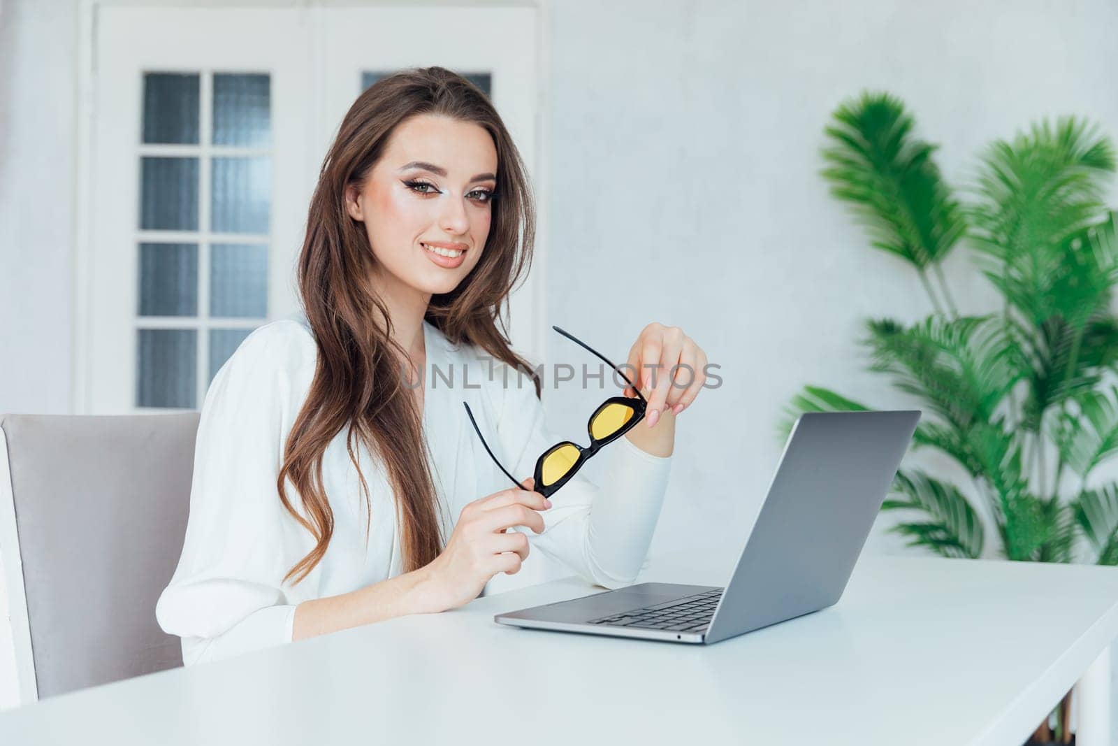 Business woman secretary with laptop in online office