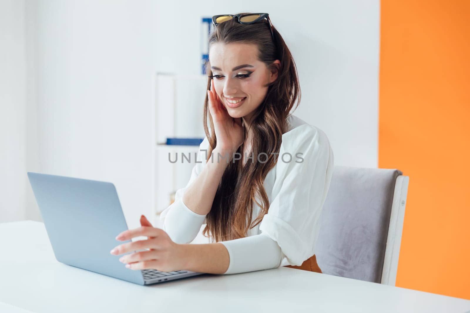 Business woman secretary with laptop in online office