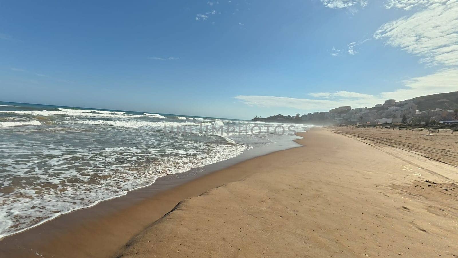 Imagine a serene beach with golden sands, gentle waves, and a clear blue sky that captivates the heart